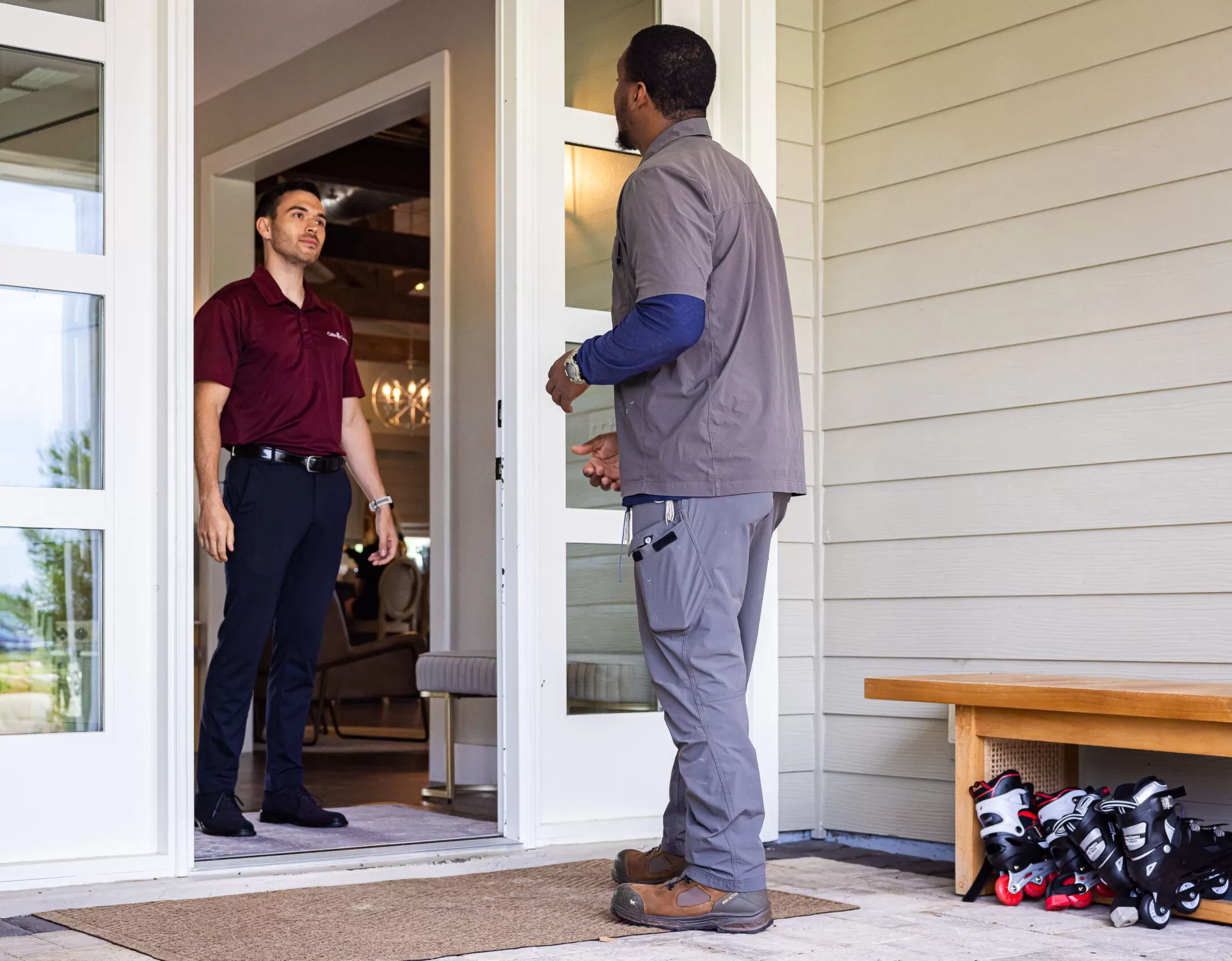 Home Owner Answering the door to a Kalos Tech